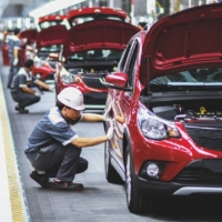 Workers operate an assembly line at Vietnam\'s first homegrown car manufacturer in Haiphong on June 2019. | MANAN VATSYAYANA / AFP / VIA GETTY IMAGES