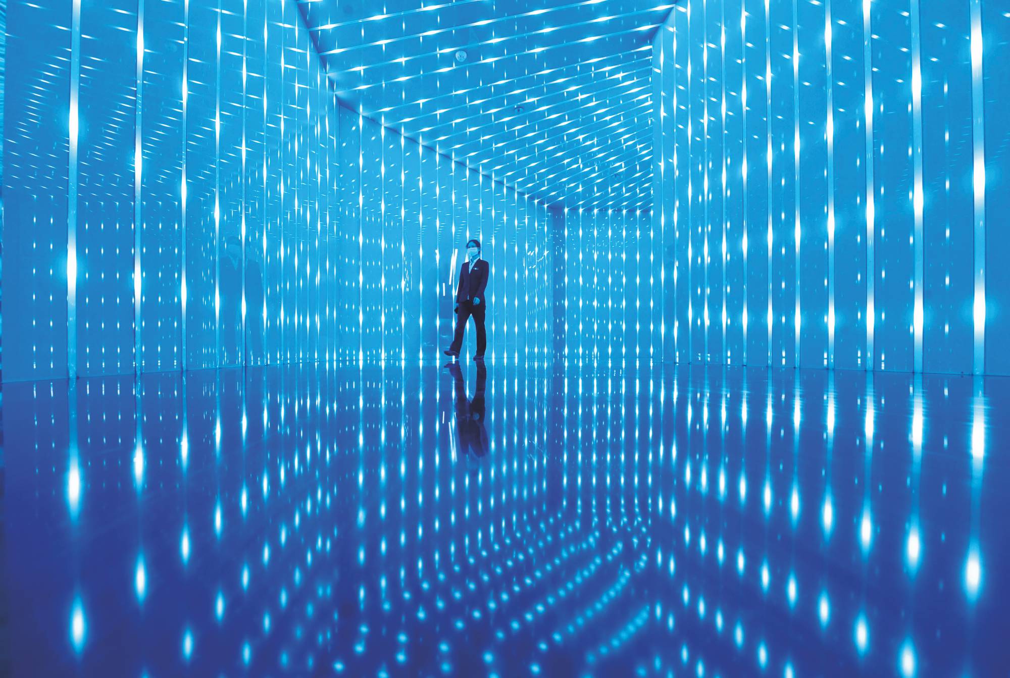 An employee walks through an exhibition hall at a branch of Chongqing City Construction Investment on Oct. 21, 2020, in Chongqing, China. | Chen Chao / China News Service / via Getty Images