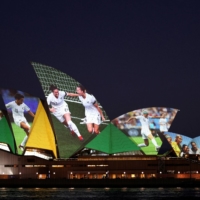 The Sydney Opera House lights up on June 25, 2020, in celebration of Australia and New Zealand\'s joint bid to host the 2023 Women\'s World Cup. | REUTERS