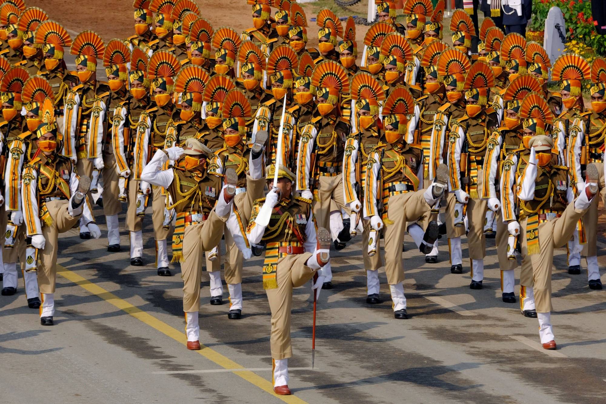 Indian Army soldiers march through the ceremonial Rajpath during the Republic Day parade in New Delhi on Jan. 26. | Bloomberg 