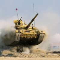 An Indian Army Bhishma T-90 battle tank performs a demonstration during the DefExpo 20 in Lucknow, Uttar Pradesh, in 2020. | BLOOMBERG 