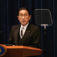 Prime Minister Fumio Kishida speaks during a news conference at the Prime Minister\'s Office in Tokyo last month. | POOL / VIA AFP-JIJI