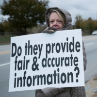 Protesters gather outside a school being used as a vaccination site in Louisville, Kentucky in November. | REUTERS