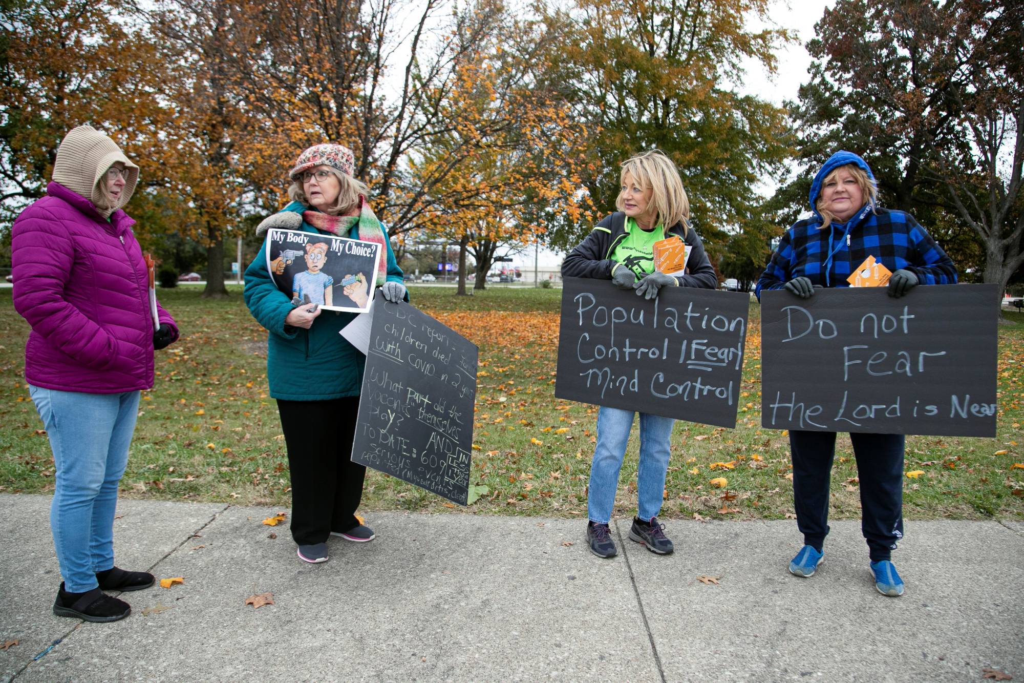 Protesters gather outside a school being used as a vaccination site in Louisville, Kentucky in November.
 | REUTERS