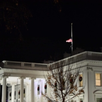 The US national flag flies at half-mast on top of the White House in memory of former Senator Bob on Sunday. | AFP-JIJI