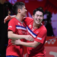 Takuro Hoki (left) and Yugo Kobayashi became the first Japanese pair to win the men\'s doubles title at the World Tour Finals on Sunday. | AFP PHOTO / BADMINTON ASSOCIATION OF INDONESIA