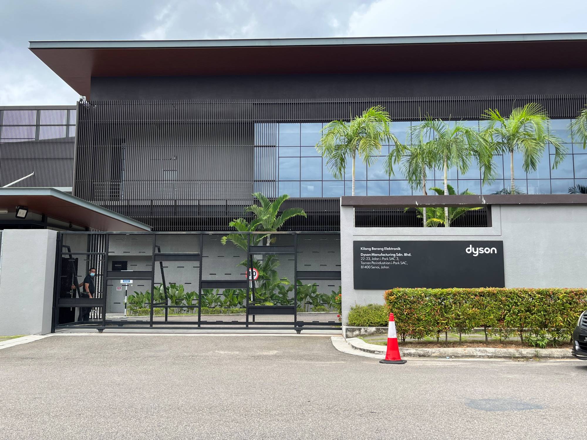 A security guard stands near the gate of Dyson office in Senai, Johor State, Malaysia | REUTERS