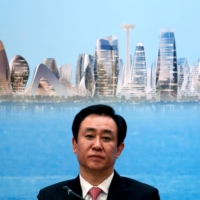 China Evergrande Group Chairman Hui Ka Yan attends a news conference on the property developer\'s annual results in Hong Kong, China in March 2017. On Tuesday the company failed to make a key coupon payments that would stave off restructuring. | REUTERS