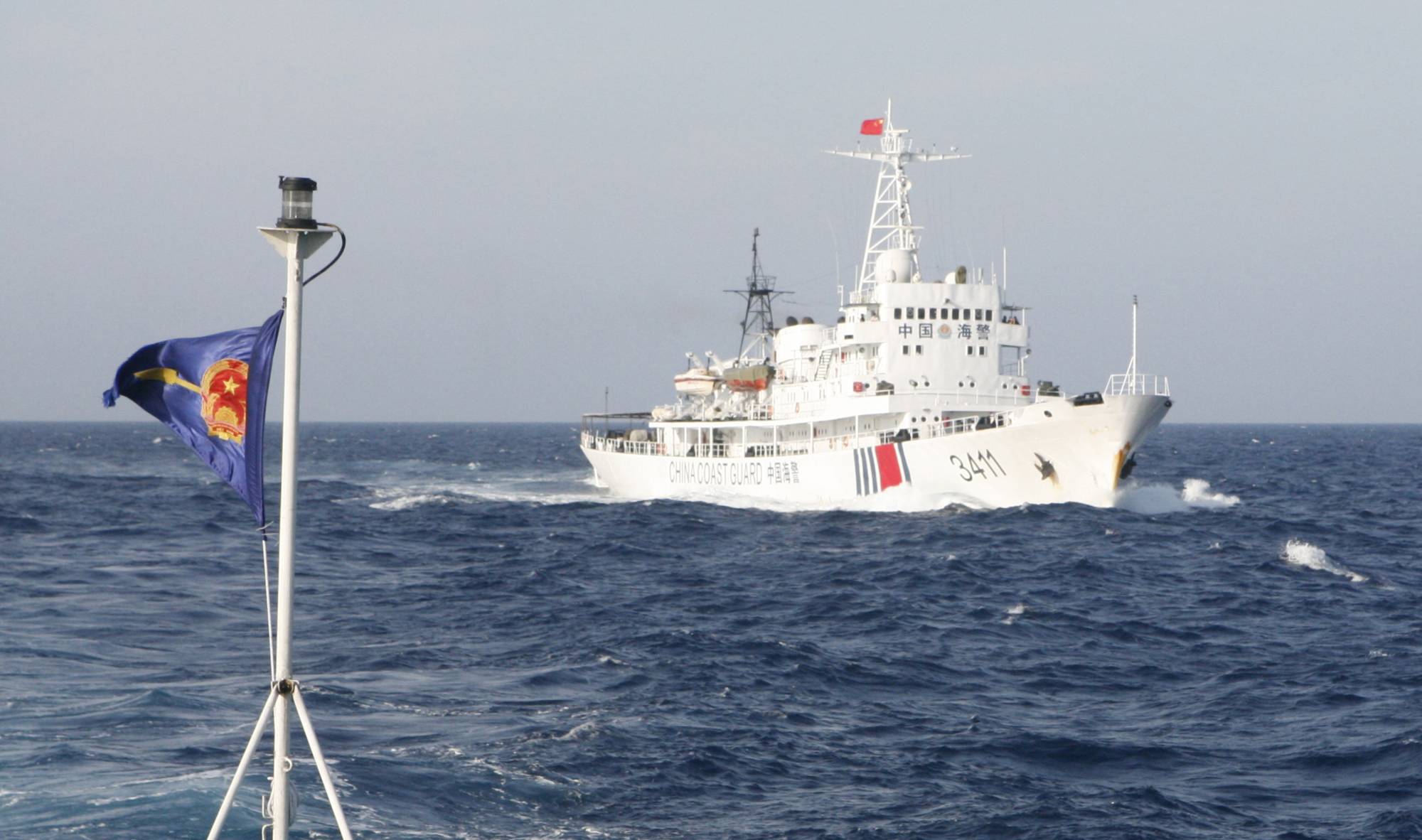 A China Coast Guard vessel follows a Vietnamese ship in contested waters in the South China Sea in May 2014. The question over sovereignty of the strategic waterway remains an intractable issue between China and ASEAN.  | REUTERS
