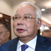 Malaysia\'s former Prime Minister Najib Razak arrives at the Kuala Lumpur High Court for his trial over 1MDB corruption allegations in August 2019. | AFP-JIJI