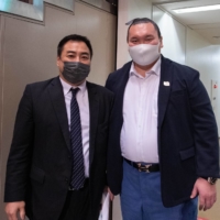 Former komusubi Kaiho and former yokozuna Hakuho pose together at the 2021 All Japan Sumo Championships at Ryogoku Kokugikan on Sunday. | JOHN GUNNING
