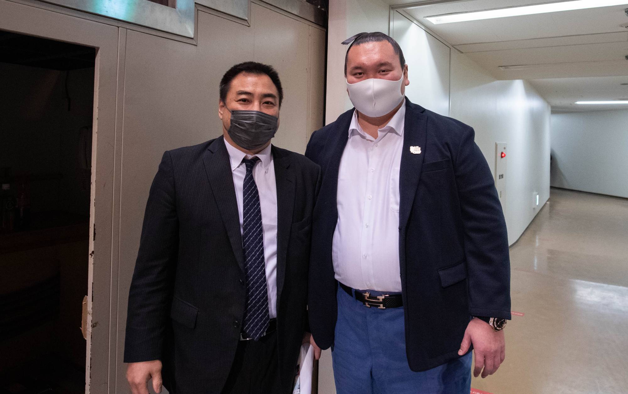 Former komusubi Kaiho and former yokozuna Hakuho pose together at the 2021 All Japan Sumo Championships at Ryogoku Kokugikan on Sunday. | John Gunning