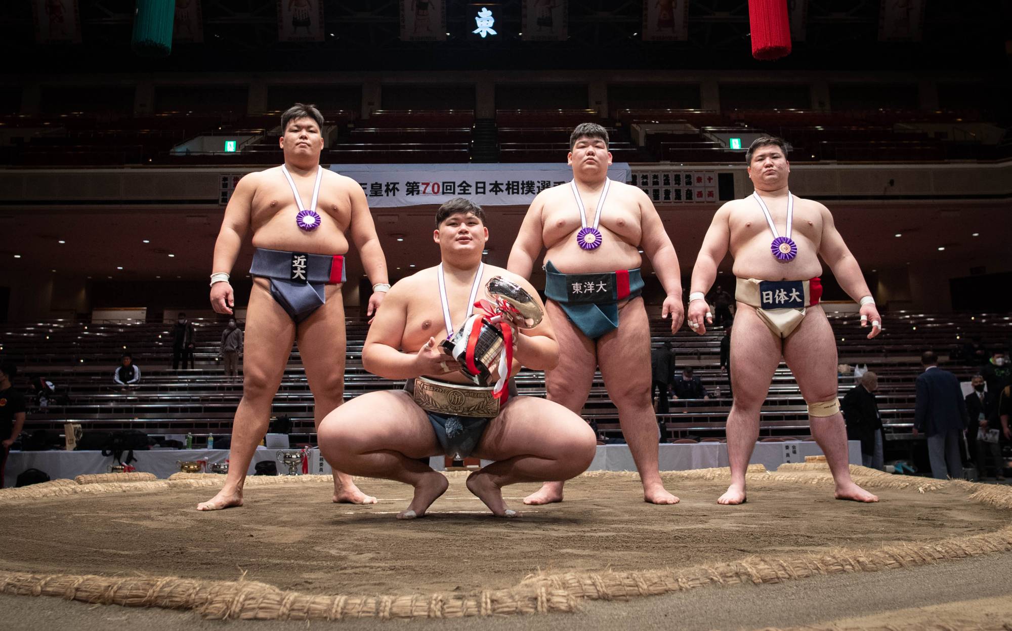 All Japan winner Daiki Nakamura (second from left) and other semifinalists pose for photos during the award ceremony at Ryogoku Kokugikan on Sunday. | JOHN GUNNING