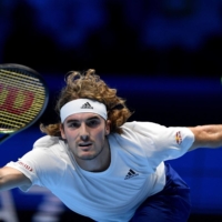Stefanos Tsitsipas hits a return against Andrey Rublev during the first round of the ATP Finals in Turin, Italy, on Nov. 15. | AFP-JIJI