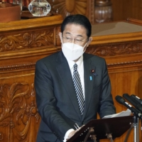 Prime Minister Fumio Kishida answers questions in the Upper House on Thursday. | KYODO 