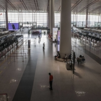 A deserted departure hall at Beijing Capital International Airport in Beijing in August. | BLOOMBERG