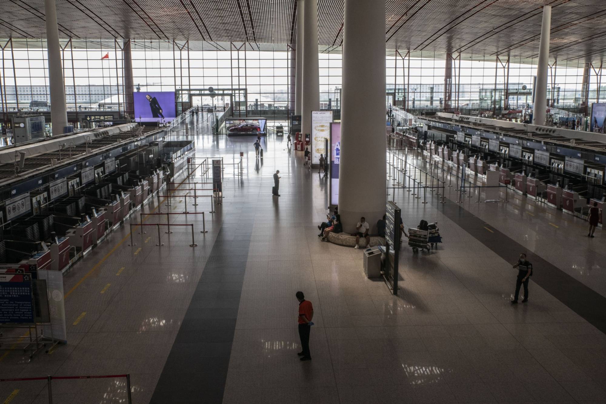A deserted departure hall at Beijing Capital International Airport in Beijing in August. | BLOOMBERG
