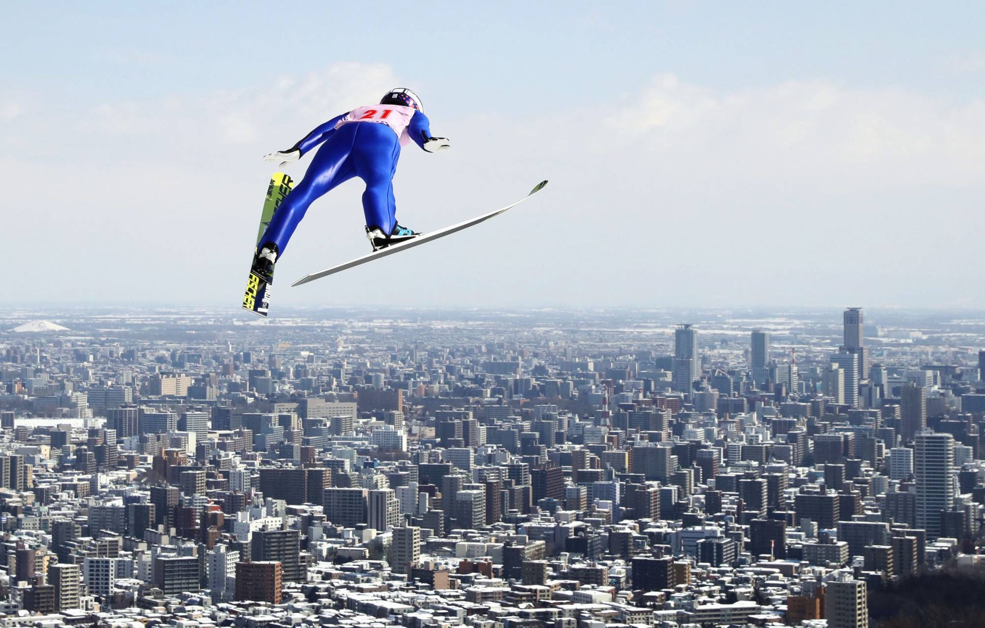A ski jumper participates in a competition in Sapporo in March 2017. Hokkaido's largest city is seeking to win the right to host the 2030 Winter Olympics and Paralympics. | KYODO