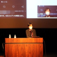 Lawyer Yasuko Morooka speaks at a rally in the city of Hiroshima on Dec. 4. Parts of the screen in the background have been blurred for privacy reasons. | CHUGOKU SHIMBUN
