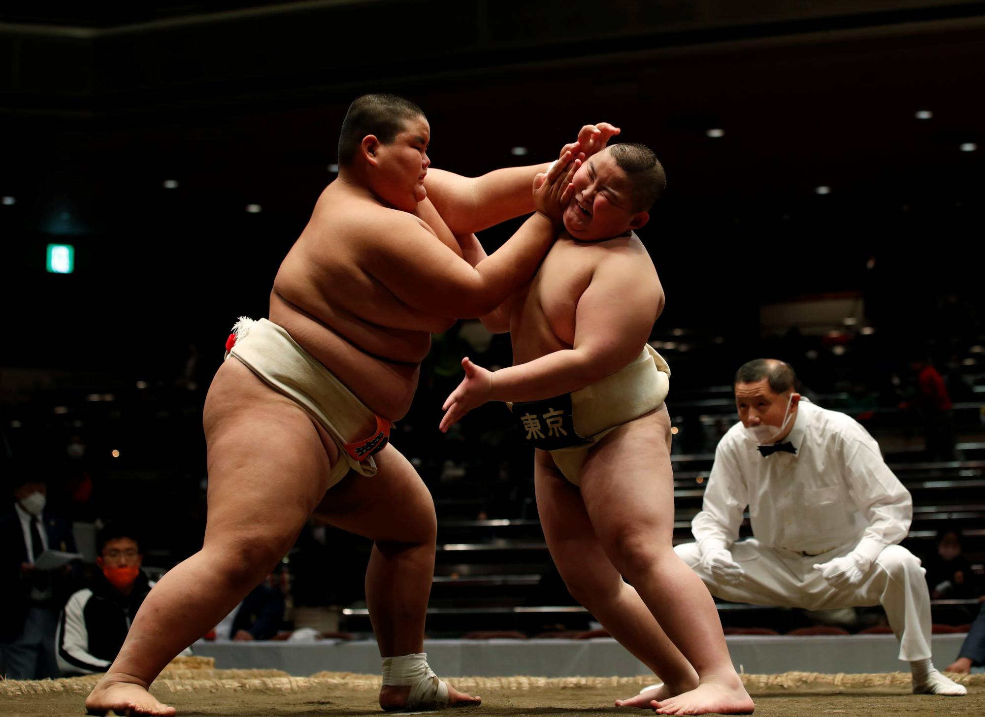 Elementary school sumo wrestler Kyuta Kumagai (right) competes against Hisatsugu Sasaki during the All-Japan Elementary School Sumo Championship at Ryogoku Kokugikan on Dec. 5. | REUTERS