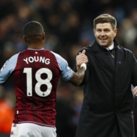 Aston Villa manager Steven Gerrard celebrates with Ashley Young after their match against Leicester City in Birmingham, England, on Dec. 5. | REUTERS