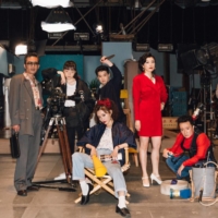 Marika Matsumoto (center) plays a first-time director in the 1980s struggling to wrangle her crew and keep the filming of her erotic melodrama on track in Eiji Uchida’s “Shrieking in the Rain.” | © 2021 TOEI / TOEI VIDEO