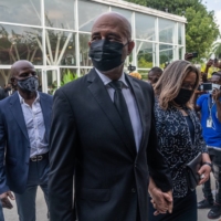 Former President Michel Martelly of Haiti and his wife, Sophia, at a reception in Port-au-Prince in July where Martine Moise and her children received condolences. | FEDERICO RIOS/THE NEW YORK TIMES