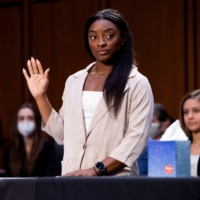 U.S. Olympic gymnast Simone Biles is sworn in to testify during a Senate Judiciary hearing about the FBI\'s handling of the Larry Nassar investigation, in Washington in September. | POOL / VIA REUTERS 