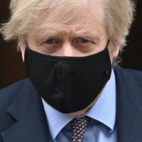 U.K. Prime Minister Boris Johnson\'s new COVID-19 measures kicked off a mutiny in his Conservative Party, with lawmakers calling his embrace of vaccine passes \"discriminatory.\" | AFP-JIJI