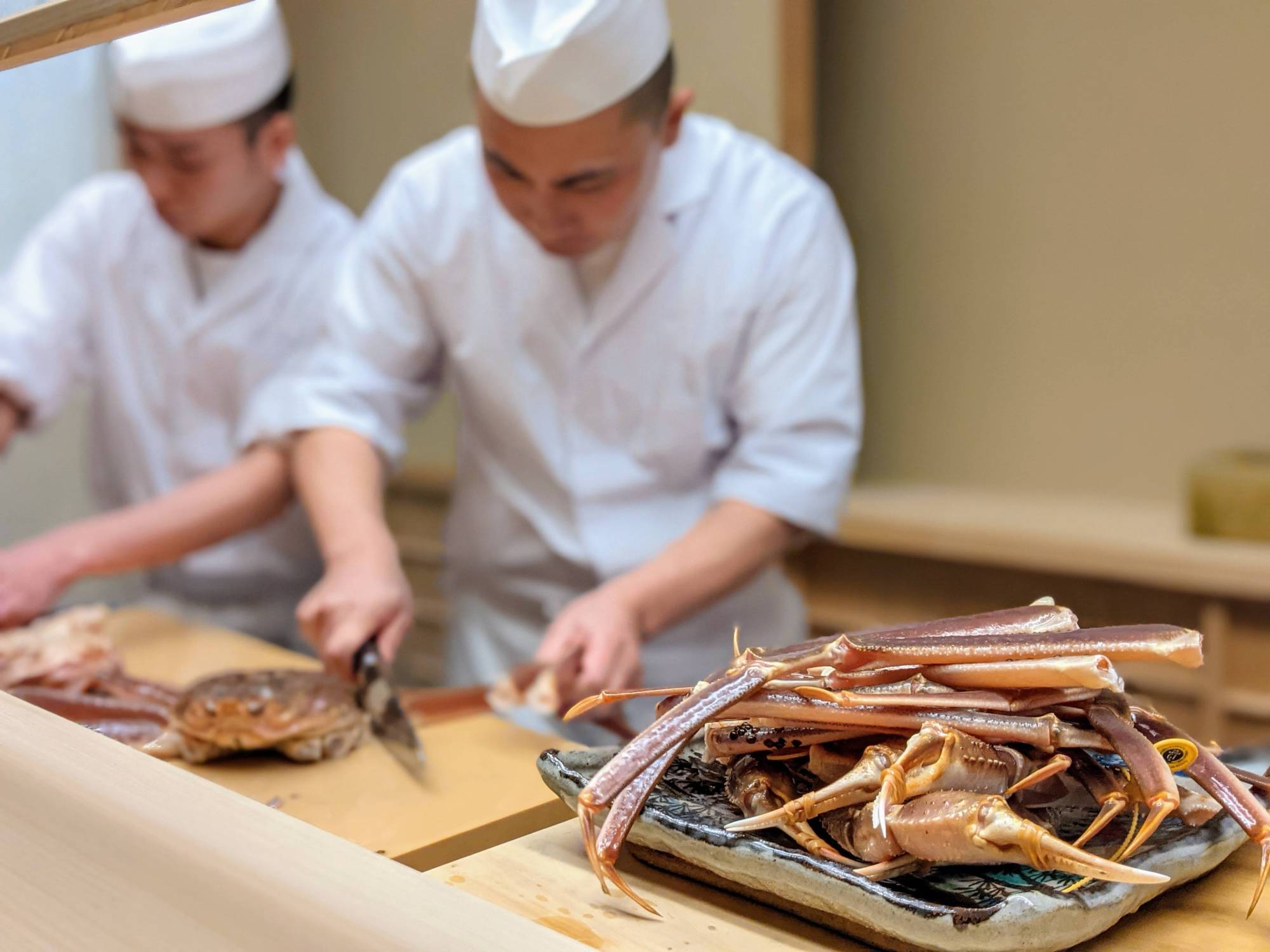 Chef Takuya Kataori prepares a feast of 'zuwaigani' snow crabs at Kataori. | TAKEFUMI HAMADA