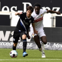 Arminia Bielefeld\'s Masaya Okugawa in action with VfB Stuttgart\'s Naouirou Ahamada on May 22. | REUTERS