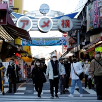 Japan is considering distributing unused cloth masks, dubbed \"Abenomasks,\" to local governments. | REUTERS