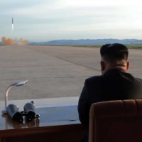 North Korean leader Kim Jong Un watches the launch of a Hwasong-12 ballistic missile at an undisclosed location in this undated photo released on Sept. 16, 2017.  | KCNA / KNS / VIA AFP-JIJI