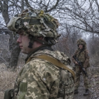 The Ukrainian Army’s 25th Airborne Brigade on patrol in Avdiika, Ukraine, on Dec. 1 | BRENDAN HOFFMAN / THE NEW YORK TIMES