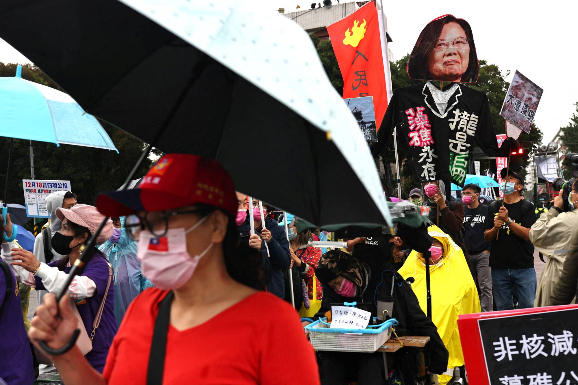 A protest march in Taipei on Sunday. Taiwanese voters will be asked if the government should reimpose a complete ban on imports of pork and pig offal containing ractopamine. | Reuters