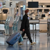 The government has denied that the latest omicron cases are examples of community infection, saying they are closely monitored cases and are traceable even if they slipped through the initial testing at airports. | AFP-JIJI