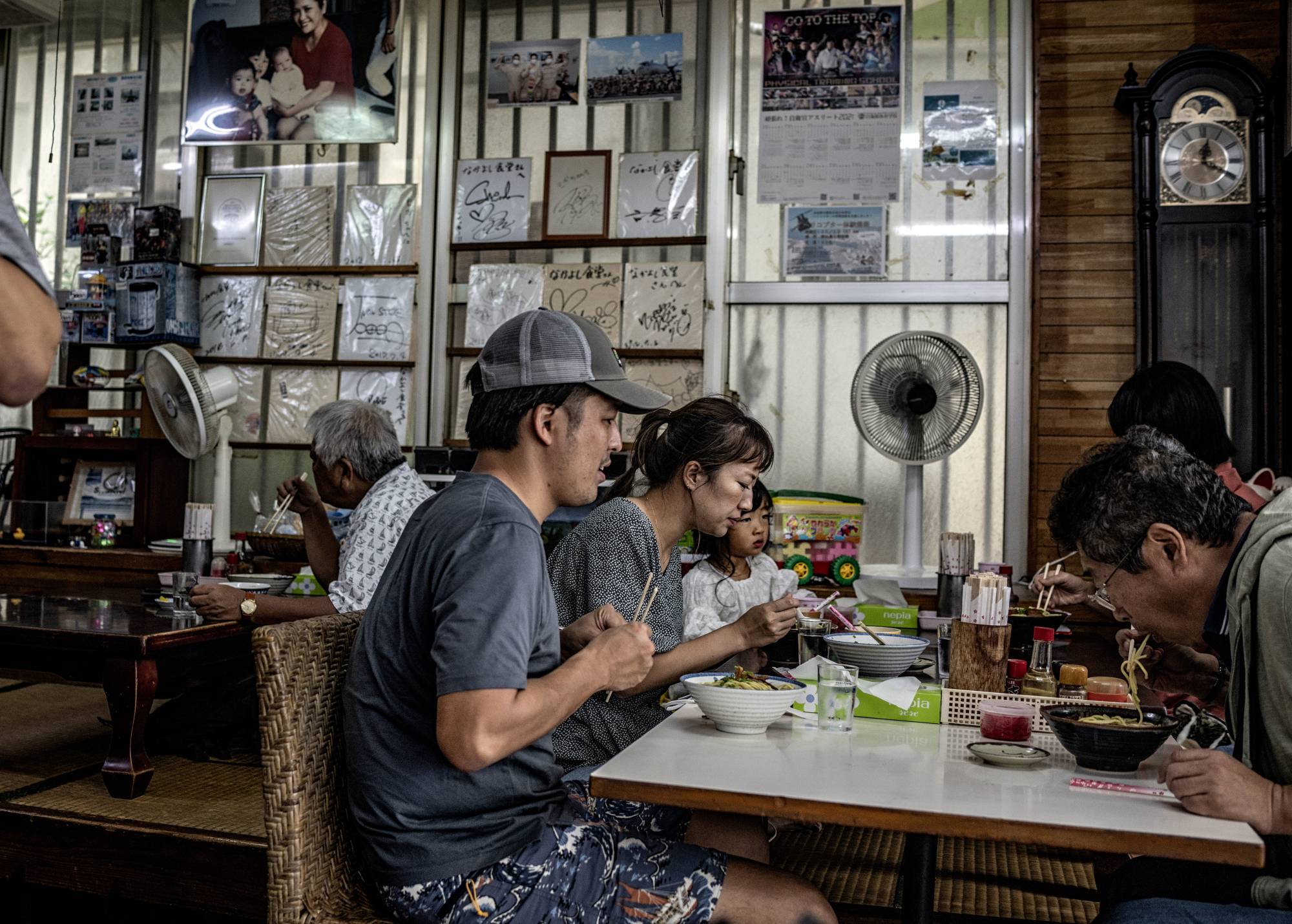 Patrons dine at a restaurant on Ishigaki on Nov. 4, 2021. People on Ishigaki long saw China more as a source of commerce than of danger, but that is changing. | The New York Times