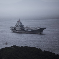 The Chinese Navy\'s Liaoning aircraft carrier sails into Hong Kong in July 2017. | BLOOMBERG