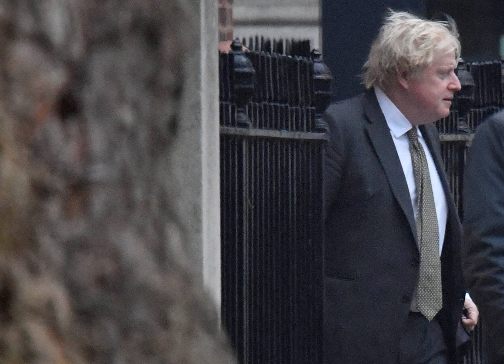 British Prime Minister Boris Johnson leaves No. 10 Downing Street in London on Saturday. | Reuters