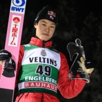Ryoyu Kobayashi poses for photos after finishing second in a World Cup event in Engelberg, Switzerland, on Saturday. | AFP-JIJI