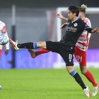 Masaya Okugawa attempts to kick the ball during Arminia\'s win over Leipzig on Saturday. | KYODO