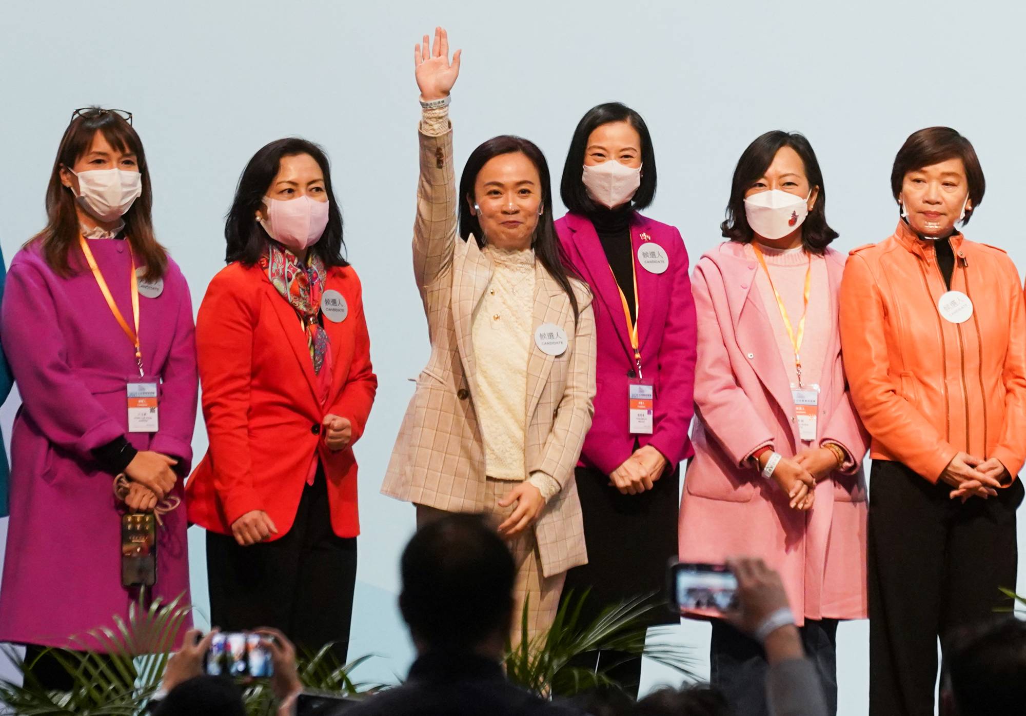 Candidates celebrate after winning in the Legislative Council election in Hong Kong on Dec. 20, 2021. | REUTERS