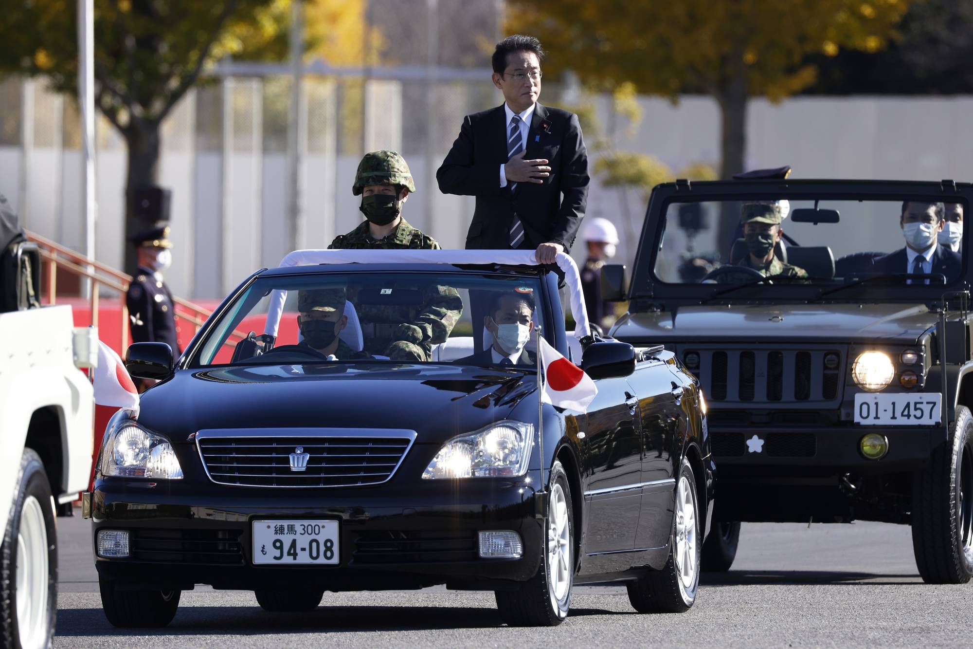 Prime Minister Fumio Kishida reviews Self-Defense Forces troops at Camp Asaka in Tokyo on Nov. 27. | BLOOMBERG