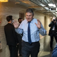 Sen. Joe Manchin departs a meeting at the Capitol in Washington on Wednesday.  | STEFANI REYNOLDS/THE NEW YORK TIMES