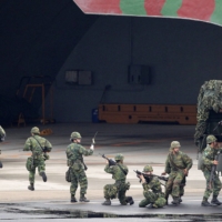 Taiwanese soldiers take part in the annual Han Kuang military exercise at the Hsinchu Air Force Base in Hsinchu city, northern Taiwan, in April 2012. | REUTERS