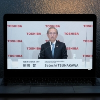 Satoshi Tsunakawa, president of Toshiba Corp., speaks during a news conference in November, when it announced it would split into three separate companies. | BLOOMBERG