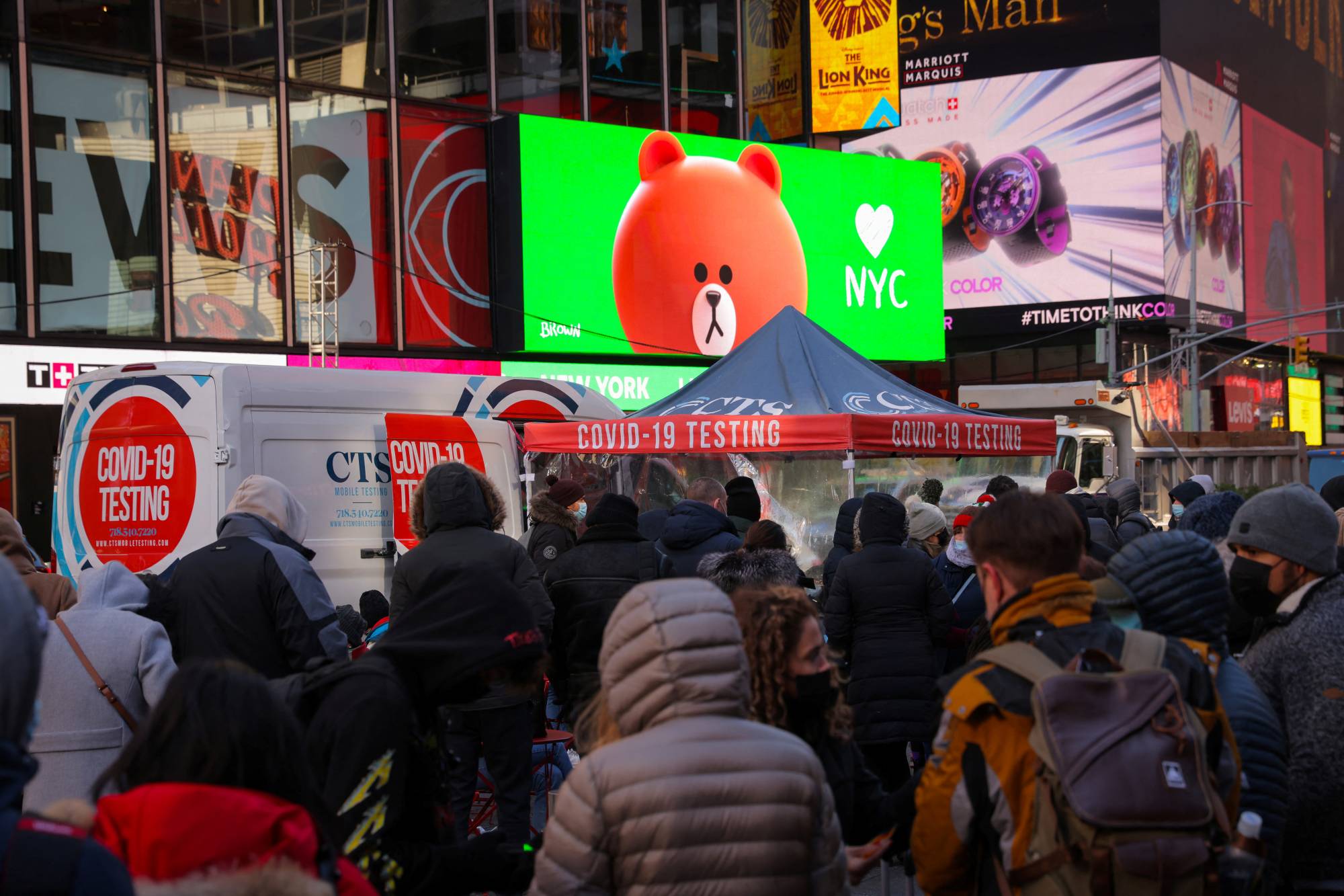 People wait to be tested for COVID-19 in Times Square, New York City on Dec.20, 2021. | REUTERS