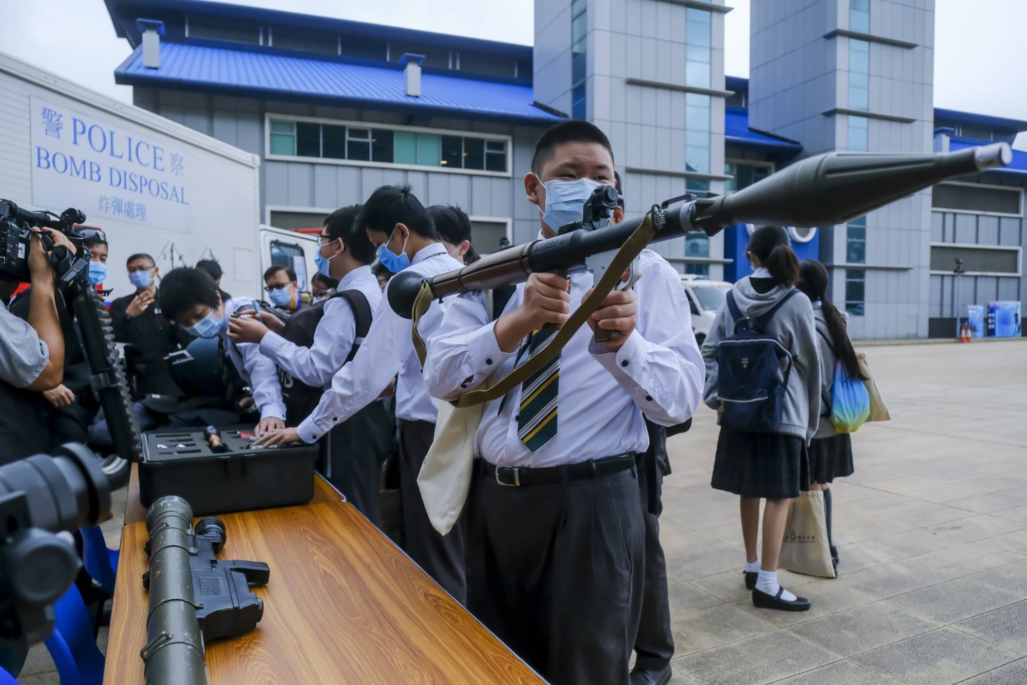 Schoolchildren during National Security Education Day at the Hong Kong Police College on April 15 | Bloomberg 