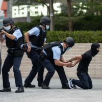 A counterterrorism exercise organized by the Hong Kong Police Force at West Kowloon Station in November | BLOOMBERG 