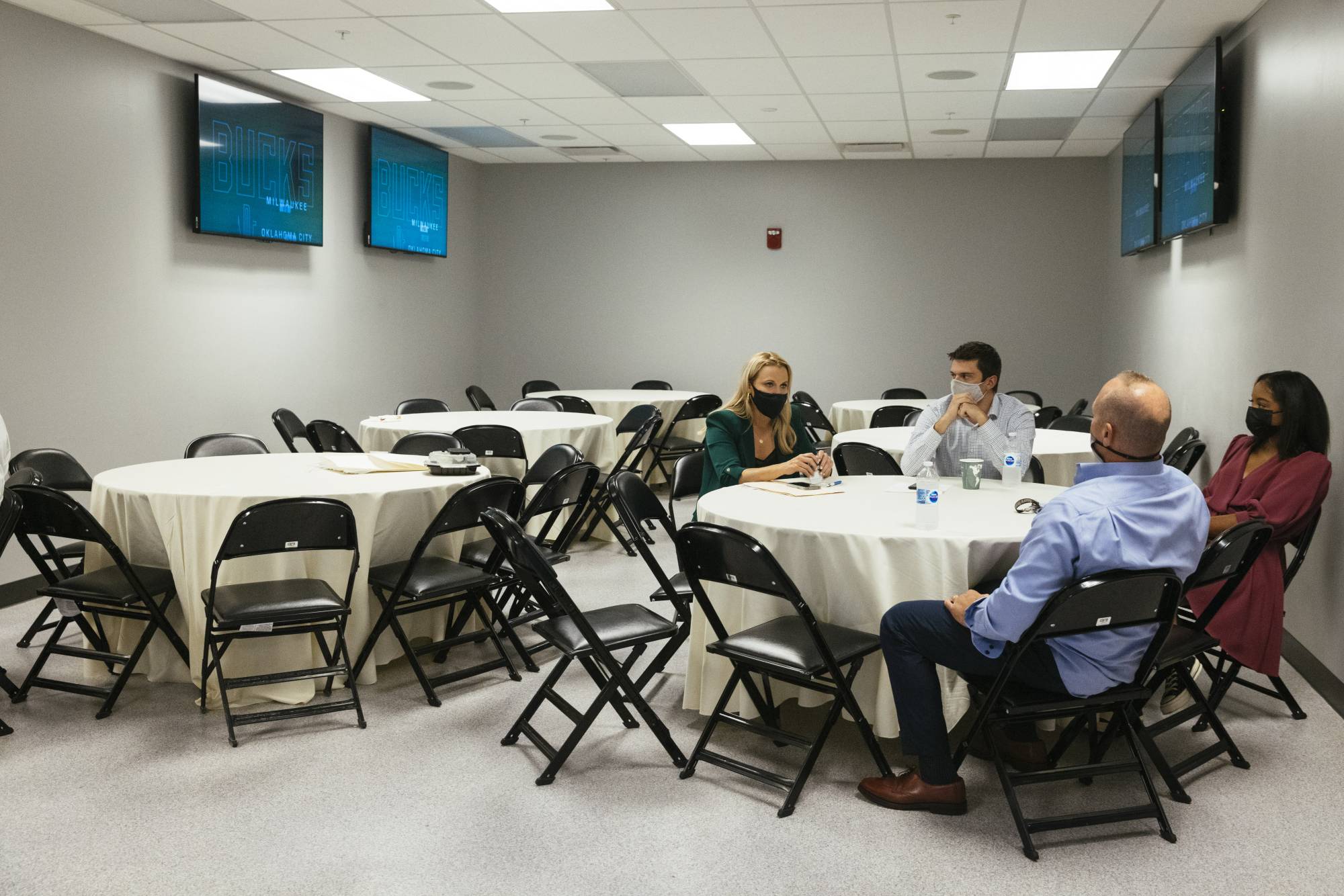 Lisa Byington (left), the first female full-time play-by-play broadcaster, preparing for a game with her broadcast team on Oct. 10. It's all hands on deck for the NBA to keep scheduled games on the calendar as teams and organizations face rising COVID-19 outbreaks. | Taylor Glascock / The New York Times